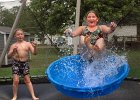 TrampolineSplash-2 copy  Caleb Morgan, 8, left, and Brooke Morgan, 11, play with a pool, a water hose, and a trampoline as they keep cool at their home in Chesnee, SC Wednesday afternoon, 7-20-05. (AP Photo/Spartanburg Herald-Journal/Tim Kimzey)